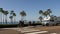 Motorhome and people, ocean tropical beach, surfers in waterfront resort. Palm trees California USA