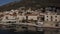 Motorhome vehicle drive on road in old town by the sea, aerial Rbbro. Europe Perast landmark