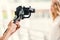 Motorized gimbal, videographer using dslr camera anti shake tool for stabilizer