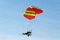 Motorized paraglider flying high in sky from side view
