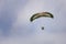 Motorized paraglider flying through the sky