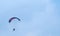 Motorized paraglider flying in the sky