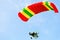 Motorized paraglider up high in blue sky