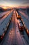 The Motorized Train Approaching a Snow Covered Station under the Majestic Sunset and Twilight. AI generated