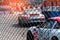 Motorsport car racing on asphalt road. View from the fence mesh netting on blurred car on racetrack background. Super racing car