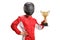 Motorsport racer with a helmet holding a gold trophy cup