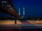 Motorway light trails and pedestrian metal bridge with a beautiful Muslim mosque in the background