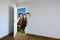 Mouflon entering a door. Animal watching from a wall. Child\'s imagination or a dream