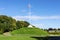 The Mound artificial hill wiith a tall flagpole in Duthie Park, Aberdeen