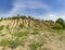 A mound formed by small piles of crushed limestone and washed away by rains