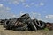 Mounds of old tractor tires and rims