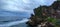 mounds of rock towering on the edge of the open sea