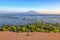 Mount Agung active volcano in Nusa Penida, Bali island, Indonesia. Sunset. Sand beach. High waves with foam spread on the coast.