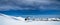 Mount Aspiring, New Zealand, October 6, 2019: Stunning panorama of a helicopter waiting to take off on top of the snowy mountain