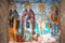 Mount Athos, Greece - October 21, 2019: Timeworn frescoes of saints on the outer side of the Church of Protaton in karyes, Mount