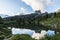 Mount Averau reflected in lake Limedes at sunrise, blue sky with clouds, Dolomites, Veneto, Italy