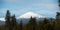 Mount Bachelor snow cap on a partially cloudy day