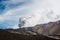 Mount Etna erupting with cloud of ash in sky