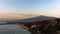 Mount Etna and the Giardini Naxos coastline at dawn