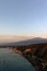Mount Etna and the Giardini Naxos coastline at dawn