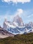 Mount Fitz Roy in the Glacier National Park on a cloudy day with some clouds. El Chalten