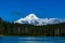 Mount Hood covered with snow and clouds against a blue sky, Frog Lake, Oregon, USA