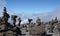 Mount Kilimanjaro / Tanzania: 5 January 2016: porters carry equipment and material through a rock desert with many stone cairns on