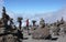 Mount Kilimanjaro / Tanzania: 5 January 2016: porters carry equipment and material through a rock desert with many stone cairns on