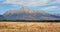 Mount Krivan peak Slovak symbol wide panorama with autumn harvested field in foreground, Typical autumnal scenery of Liptov