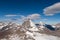 Mount Matterhorn covered with clouds on a clear day after snow fall in autumn, Valais