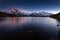 Mount Mont Blanc covered in the snow reflecting on the water in the evening in Chamonix, France