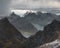 Mount Munken above fjords under a stormy sky on the Lofoten Islands in Polar Norway