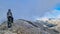 Mount Olympus - Man with helmet sitting on cloud covered mountain summit of Skolio peak on Mount Olympus