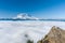 Mount Rainier above the clouds from High Rock Lookout in June