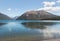 Mount Robert reflecting in lake Rotoiti, New Zealand