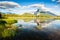 Mount Rundle with blue sky reflecting in Vermilion Lakes