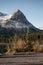 Mount Rundle with wooden bench on Rundle Forebay in autumn at Canmore