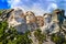 Mount Rushmore, cloudy with blue skies