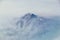 Mount Shasta aerial view from airplane, Northern California Cascade Range fog smoke from wildfires, forest fires. Siskiyou County,