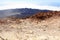 Mount Teide volcanic crater with fumarole emitting sulfur dioxide and mountain panorama on Canary Island Tenerife, Spain