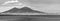 Mount Vesuvius seen from the shores of the golf of Naples, Italy in  black and white