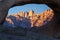 Mount Whitney sunrise alpenglow first light viewed through Mobius Arch tunnel view