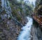 Mountain alpine autumn Wimbachklamm gorge and Wimbach stream with wooden path, Berchtesgaden national park, Alps, Bavaria, Germany