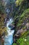 Mountain alpine autumn Wimbachklamm gorge and Wimbach stream with wooden path, Berchtesgaden national park, Alps, Bavaria, Germany