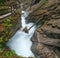 Mountain alpine autumn Wimbachklamm gorge and Wimbach stream with wooden path, Berchtesgaden national park, Alps, Bavaria, Germany