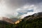 Mountain autumn landscape with alpine pine bushes and white cloudy background