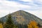 The mountain autumn landscape with colorful forest. Colorful autumn landscape in the Carpathian mountains. Deciduous forest in hi