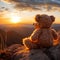 Mountain backdrop, teddy bear toy sits peacefully, sunset serenity captured