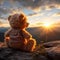 Mountain backdrop, teddy bear toy sits peacefully, sunset serenity captured