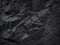 Mountain background texture. Close-up. Black rock background. Dark gray stone background.